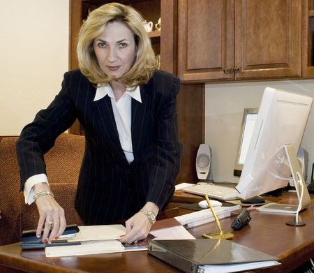 Female executive at her deskの写真素材