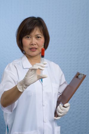 Doctor or Nurse standing with syringeの写真素材