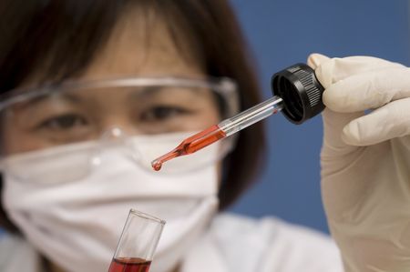 Asian woman working in a medical labの写真素材