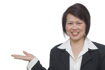 Friendly Asian woman with hand gesture and copy space over whiteの写真素材