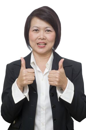 Attractive Asian business woman looking at camera and smilingの写真素材