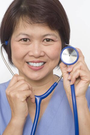Attractive Asian medical professional with stethoscopeの写真素材