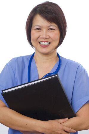 Attractive Asian medical professional with patients recordsの写真素材