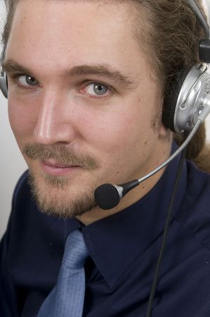 businessman with headset and friendly smileの写真素材