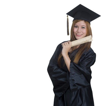 Young woman with graduation cap and gown の写真素材