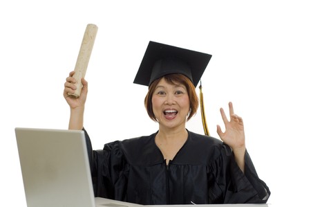 Mature woman with graduation cap and gown の写真素材
