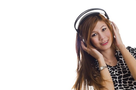Sexy young girl listening to music on headphonesの写真素材