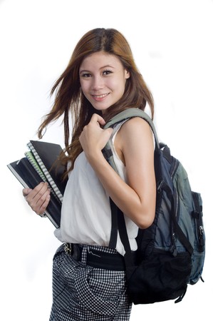 Young attractive female Asian student holding her school booksの写真素材