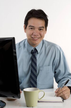 Asian businessman working with computerの写真素材