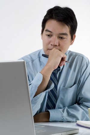 Asian businessman working with computerの写真素材