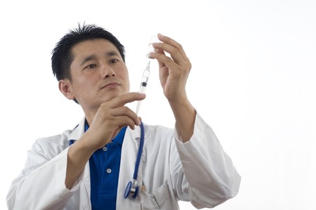 Doctor or Nurse standing with syringeの写真素材