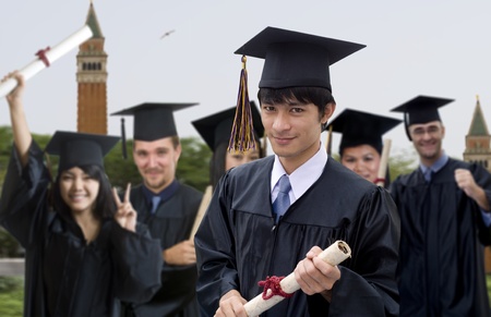 Young woman with graduation cap and gown の写真素材