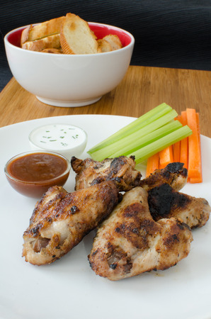 Grilled Chicken wings with dipcelery and carrotsの写真素材