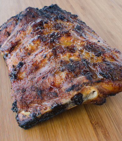 Spareribs on grill with dip, toasted baguetteの写真素材