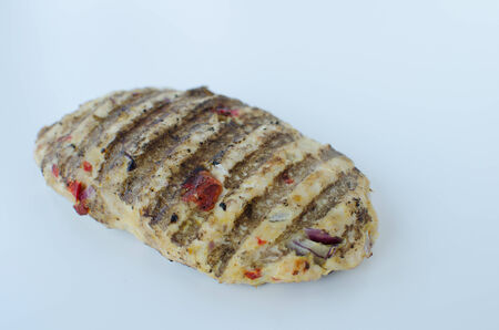 Grilled chicken isolated with paprika, garlic and corianderの写真素材