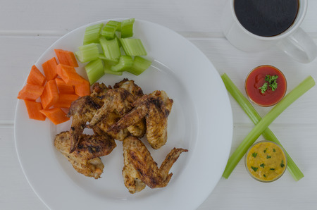 Chicken wings with dip and vegetablesの写真素材