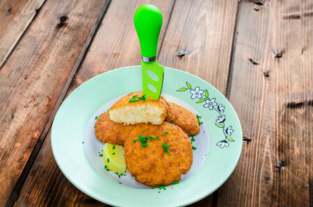 Vegetable pancakes from cauliflower on wood tableの写真素材