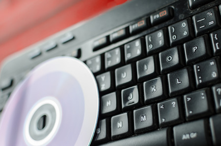 Keyboard with CD, CD half copy and shinyの写真素材