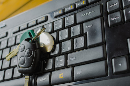 Keyboard with CD, CD half copy and shiny and keys from carの写真素材