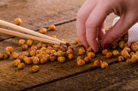 Roasted chickpeas spiced curry, chilli peppers and Hungarian papricaの写真素材
