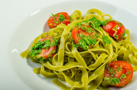 Pasta with basil pesto and pine nutsの写真素材