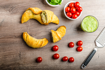 Mini Calzone roll with herbs and cheese, fresh herbs smoothieの写真素材