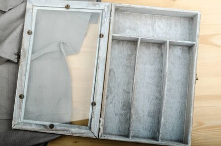 Kitchen cloth and free box on wood background, advertisment placeの写真素材