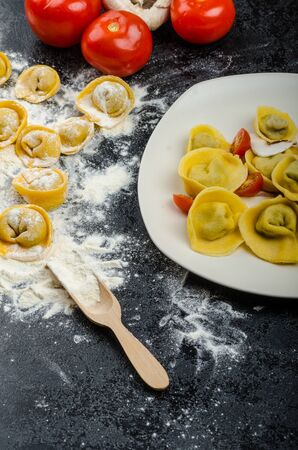homemade pasta tortellini stuffed mushrooms, garlic and cheese, from real semolina flour from Italyの写真素材