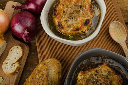 It is the French onion soup with baked toast with cheese on top, rustic pastryの写真素材