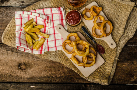 Onion rings, hot dip, french fries and Czech beer, all homemade, all original.の写真素材