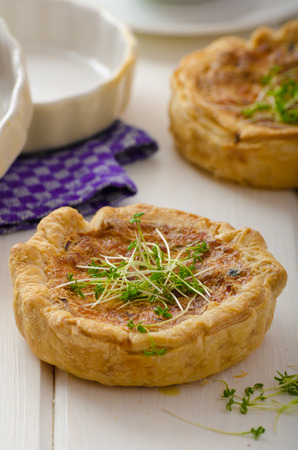 Onion mini quiche with bacon and corn, sprinkled bio microgreens, home grow up, organicの写真素材