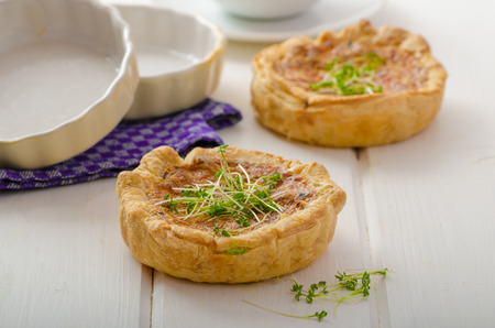 Onion mini quiche with bacon and corn, sprinkled bio microgreens, home grow up, organicの写真素材