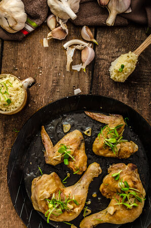 Bio roast chicken with herbs and garlic, couscous, organic garlic from gardenの写真素材
