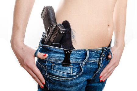 Concealed carry gun in his waistband, home safety, under lawの写真素材