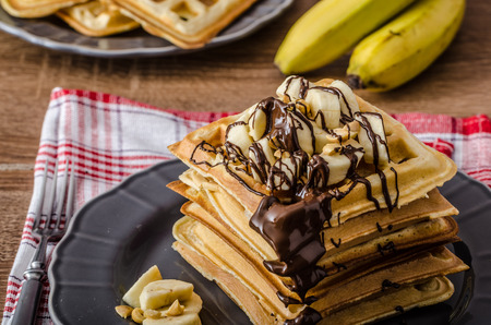 The original Belgian waffles with bananas, nuts and chocolateの写真素材