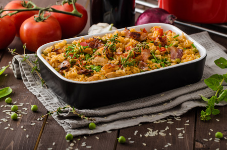 Cajun chicken with rice,  full of flavor and hot spices with fresh vegetable bio peasの写真素材