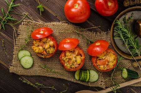 Grilled tomatoes stuffed herbs and salsaの写真素材