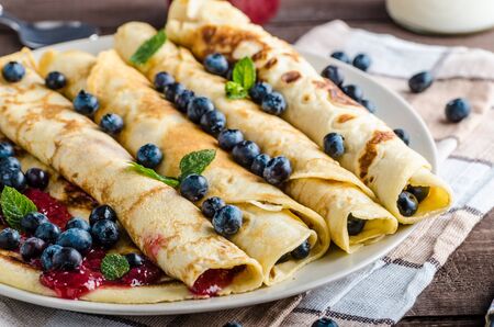 Pancakes with jam and blueberries, product photo