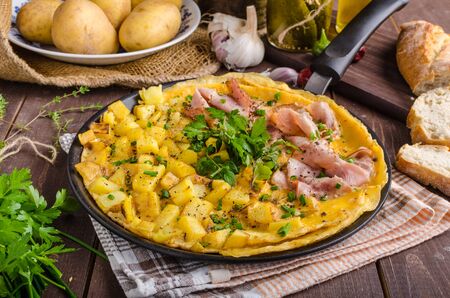 Frittata with herbs and ham, rustic style, delicious with herbs and bio hamの写真素材