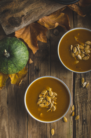 Halloween pumpkin soup with roasted pumpkin seeds, delicious and scary!!!の写真素材
