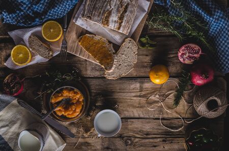 Still life photography, domestic bread spread with homemade bio apricot jamの写真素材
