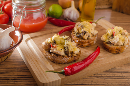 Devil toast with chicken meat and chilli, cheese gratinの写真素材