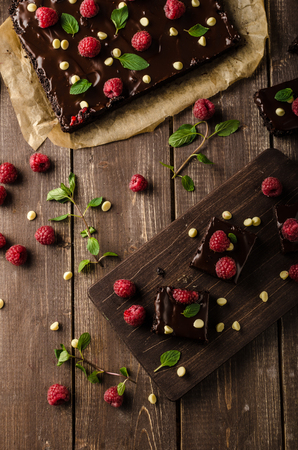 chocolate brownies with mint, raspberry and white chocolateの写真素材