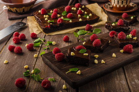 chocolate brownies with mint, raspberry and white chocolateの写真素材