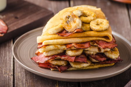 Pancakes with bacon, banana and maple sirup, delicious and simple breakfastの写真素材