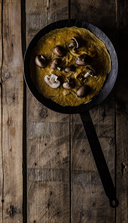 Omelette with forest mushrooms, rustic styled photo, place for advertisingの写真素材