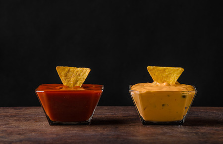 Tortilla chips with two dips, chilli hot and cheese dip