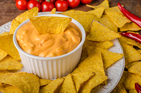 Tortilla chips with two dips, chilli hot and cheese dipの写真素材