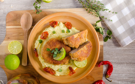 Minced meat schnitzel with cheese and mashed potato