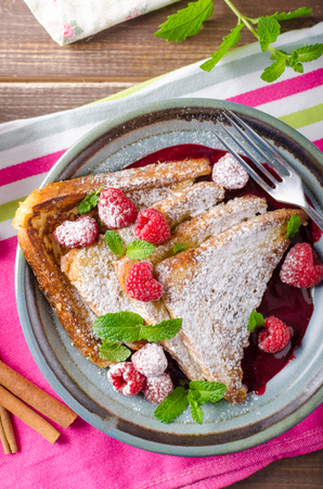 French toast with berries, mint and cinnamonの写真素材